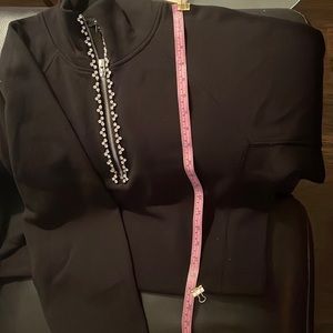 Black top could be a turtle neck with rhinestones zip up